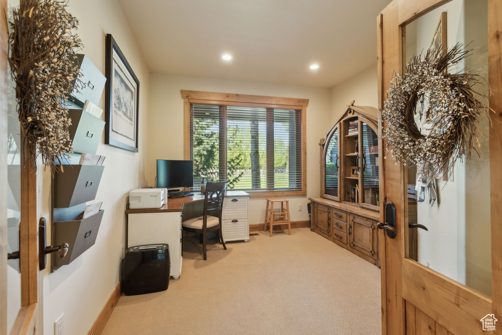 Home office with light colored carpet, baseboards, recessed lighting, and french doors