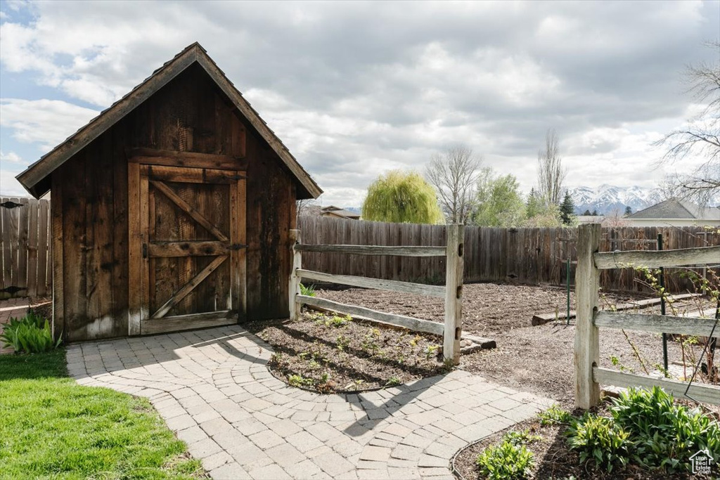 View of shed featuring a fenced backyard
