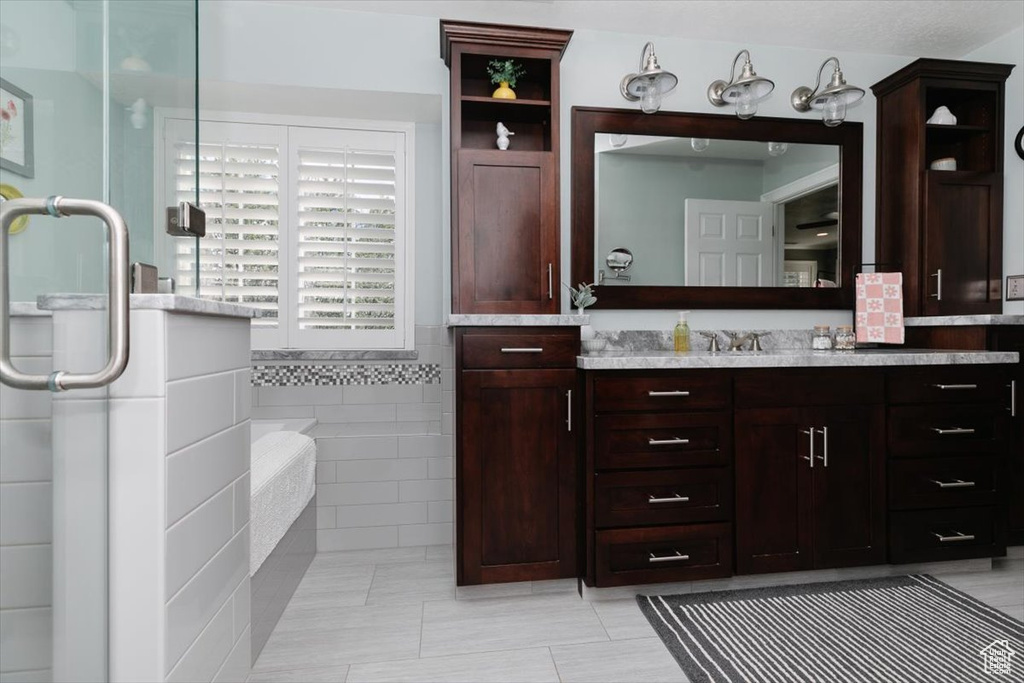 Full bathroom featuring vanity