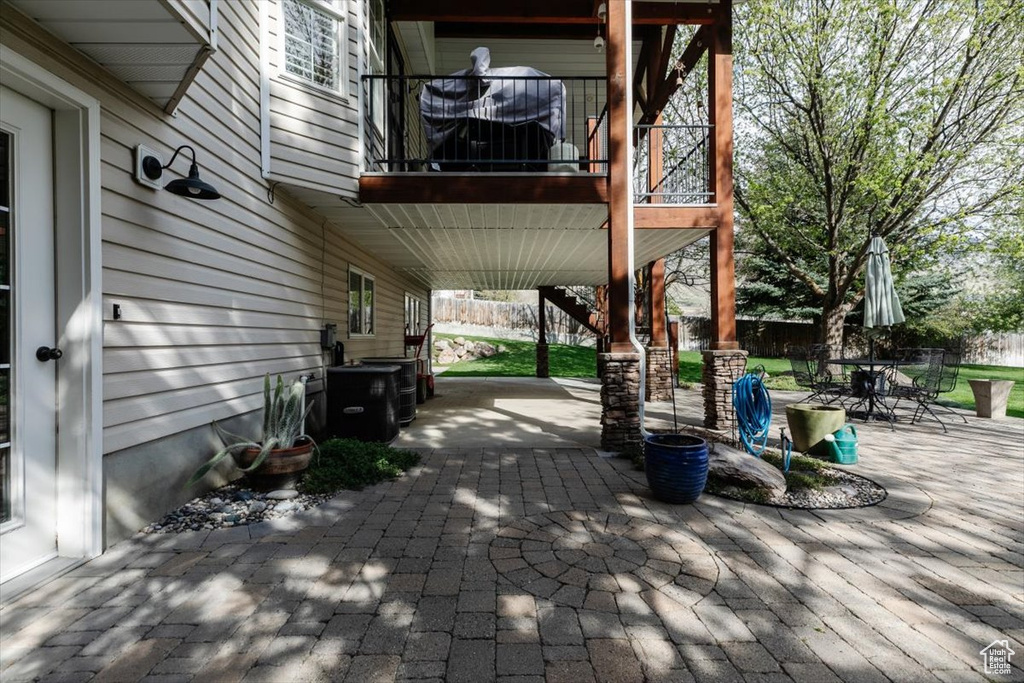 View of patio / terrace featuring outdoor dining area and a balcony