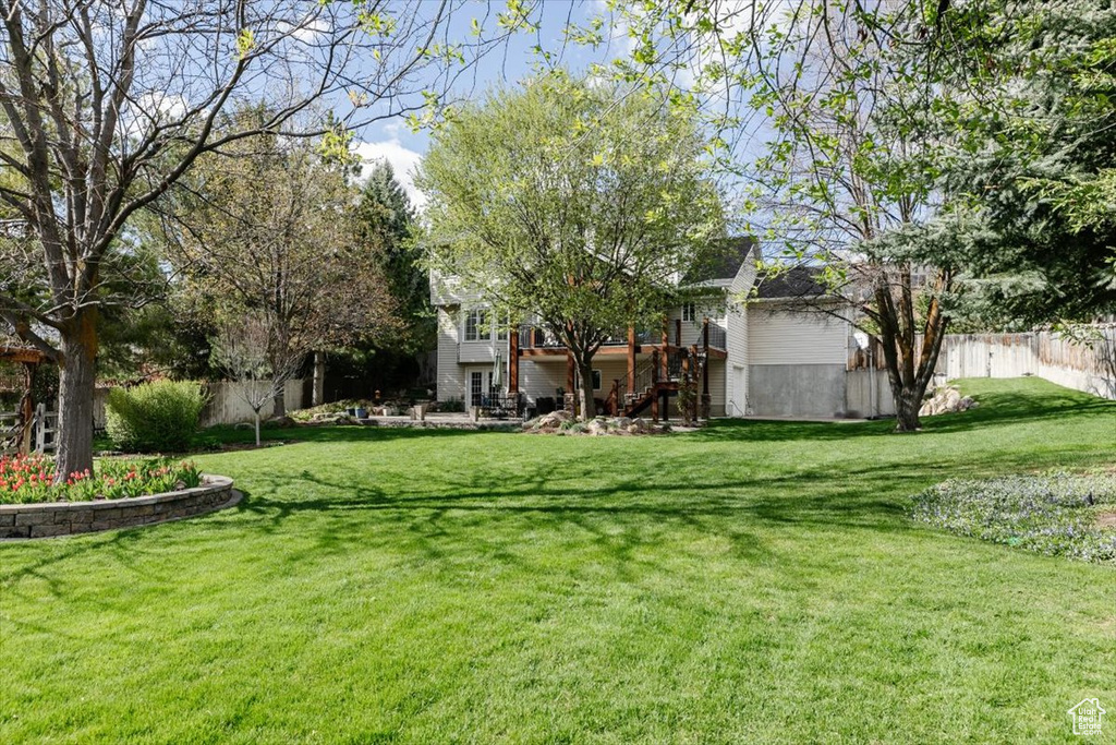 View of yard featuring fence