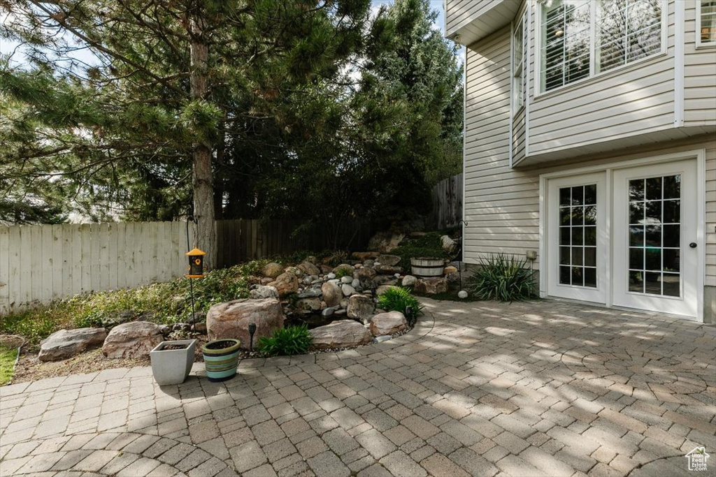 View of patio with fence