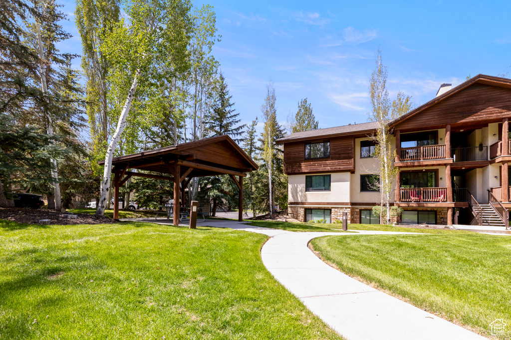 View of property's community featuring a gazebo and a lawn