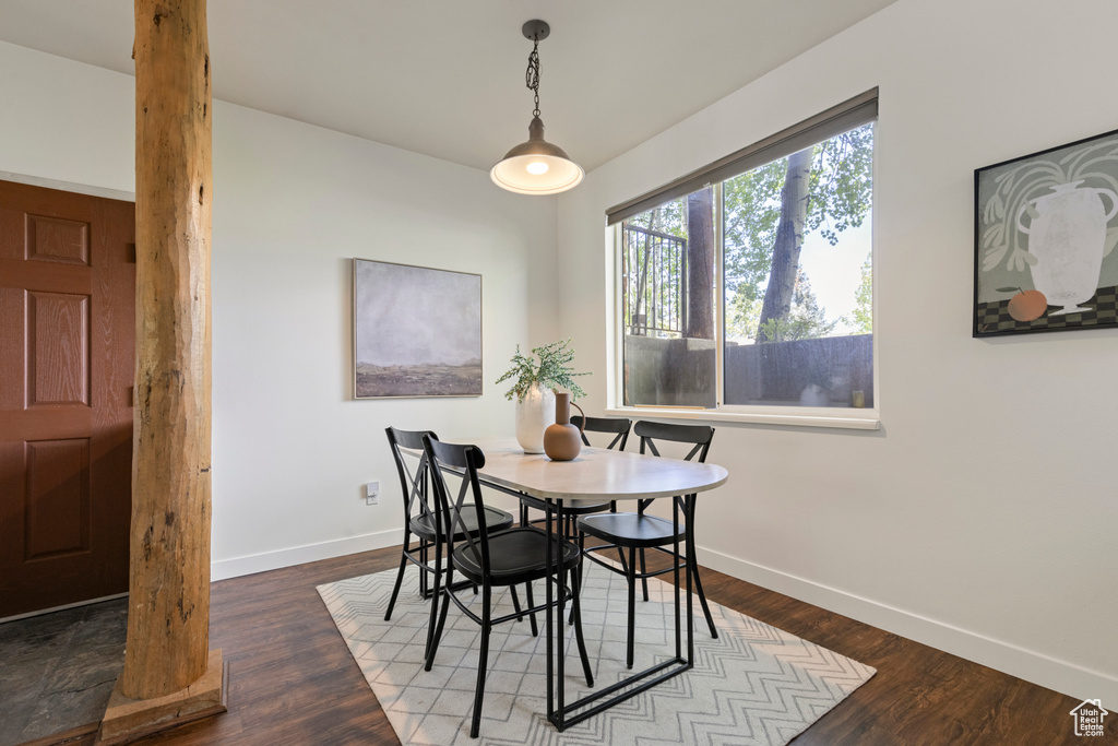 Dining area featuring baseboards and wood finished floors