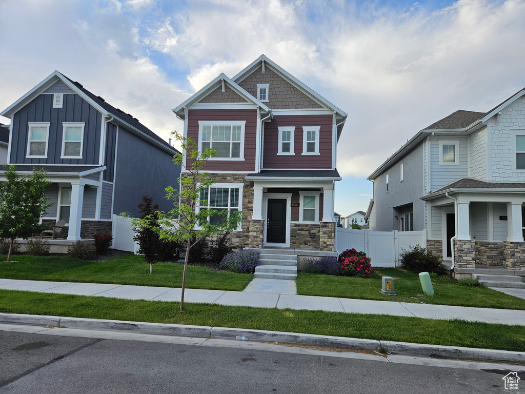 Craftsman house featuring stone siding