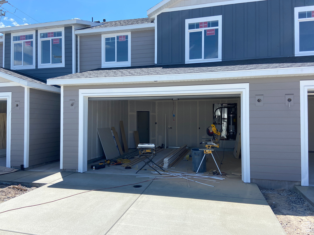 Garage featuring driveway