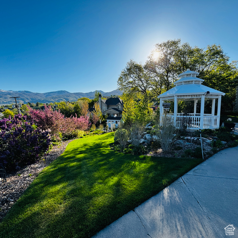 View of yard with a gazebo and a mountain view