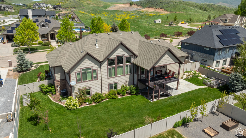 Aerial view of residential area featuring a mountainous background