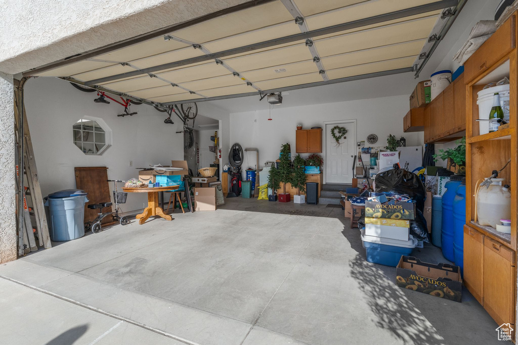 Garage featuring a garage door opener