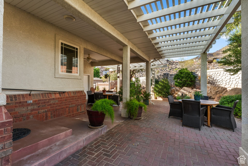 View of patio / terrace featuring outdoor dining area, a pergola, and a fenced backyard