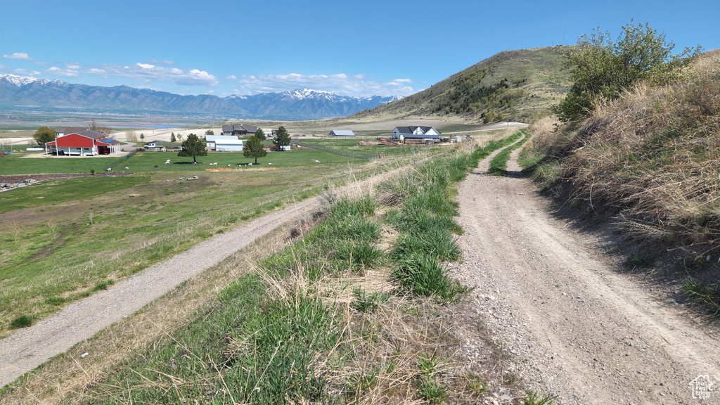View of road with a rural view and a mountain view
