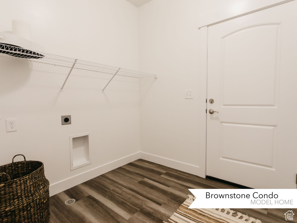 Clothes washing area with electric dryer hookup, baseboards, dark wood-style floors, and laundry area