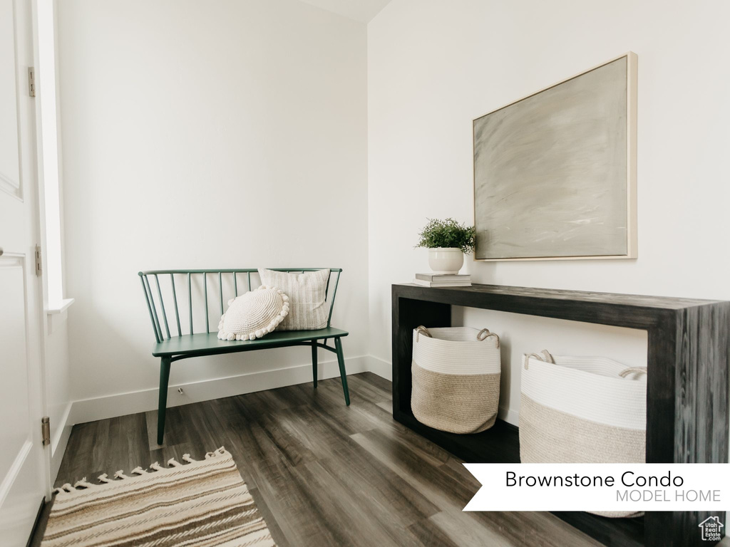 Office space with baseboards and wood finished floors