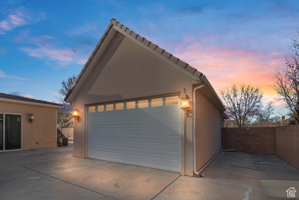 Garage featuring fence
