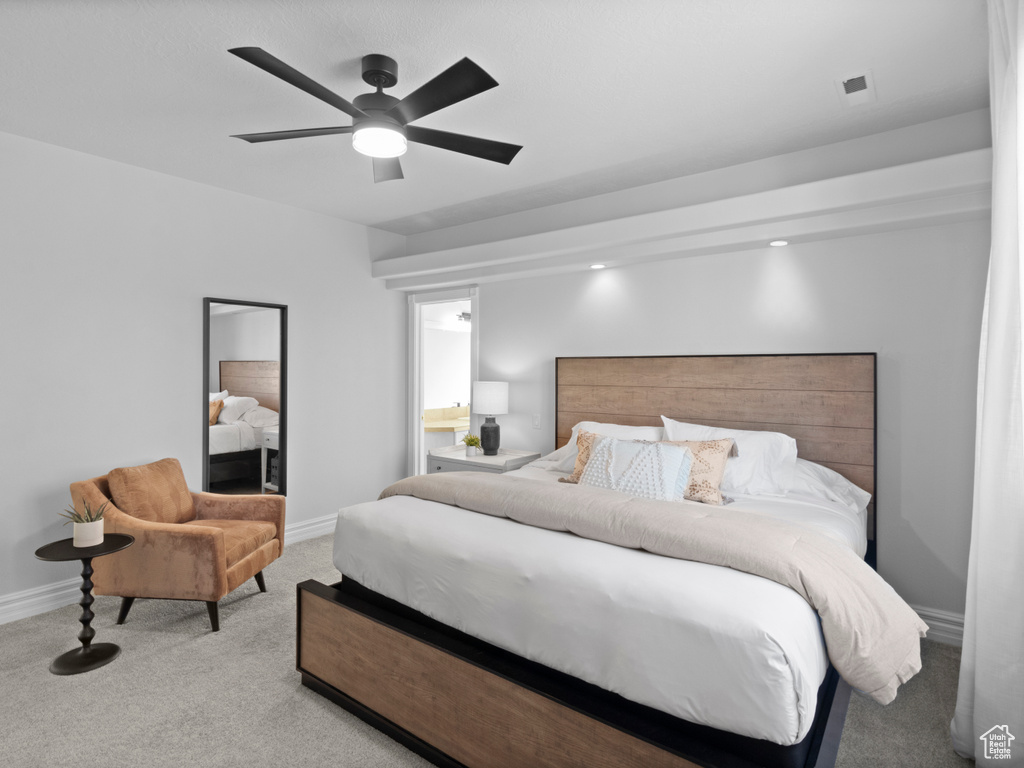 Carpeted bedroom featuring baseboards and ceiling fan