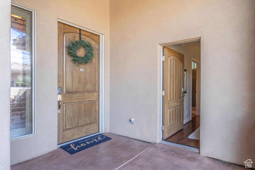 View of exterior entry with stucco siding