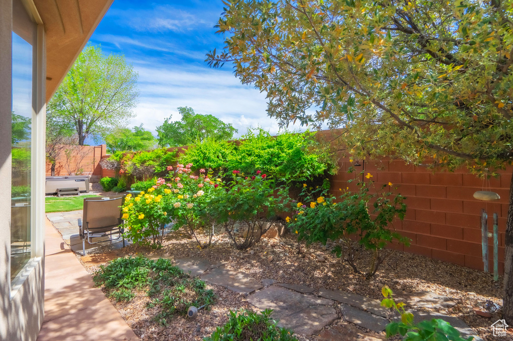 View of yard with a fenced backyard and a patio