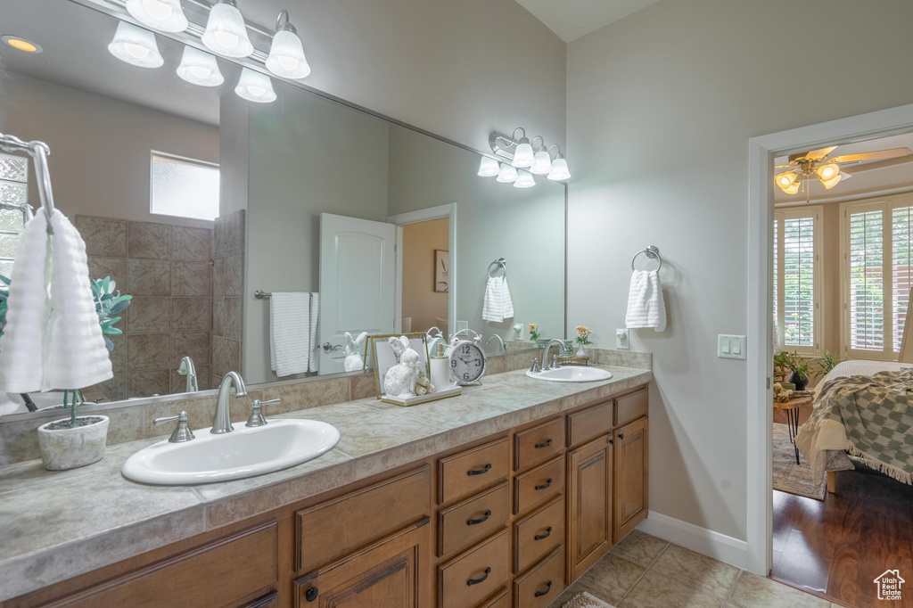 Ensuite bathroom with tile patterned floors, ensuite bathroom, a sink, and double vanity