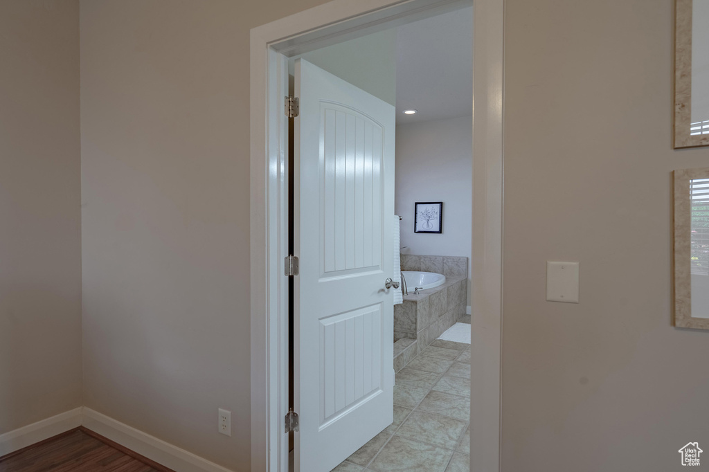 Corridor featuring baseboards