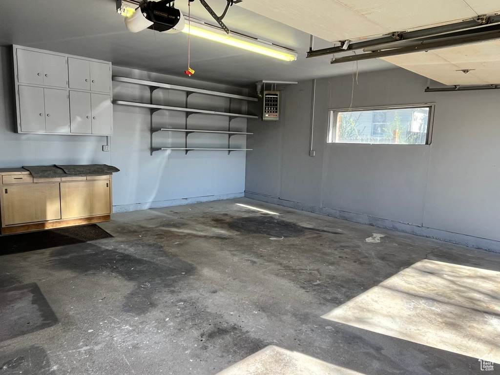 Garage featuring a garage door opener