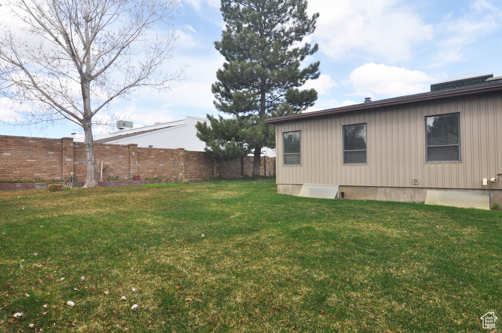 View of yard with fence