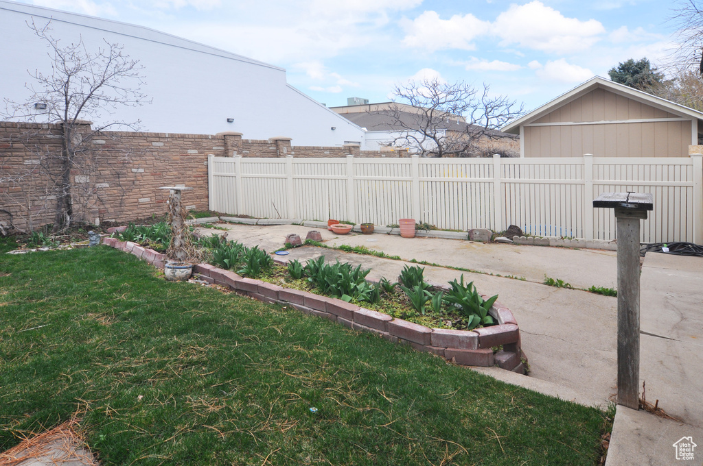 View of yard with a fenced backyard