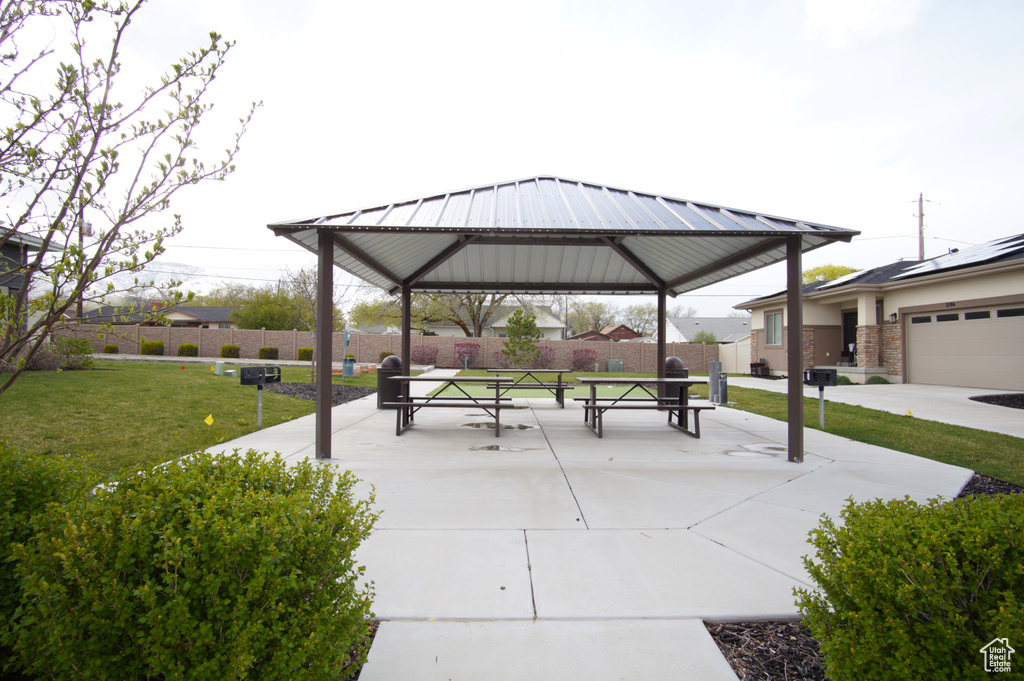 Surrounding community with a gazebo, a yard, and fence