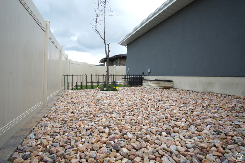 View of yard featuring fence
