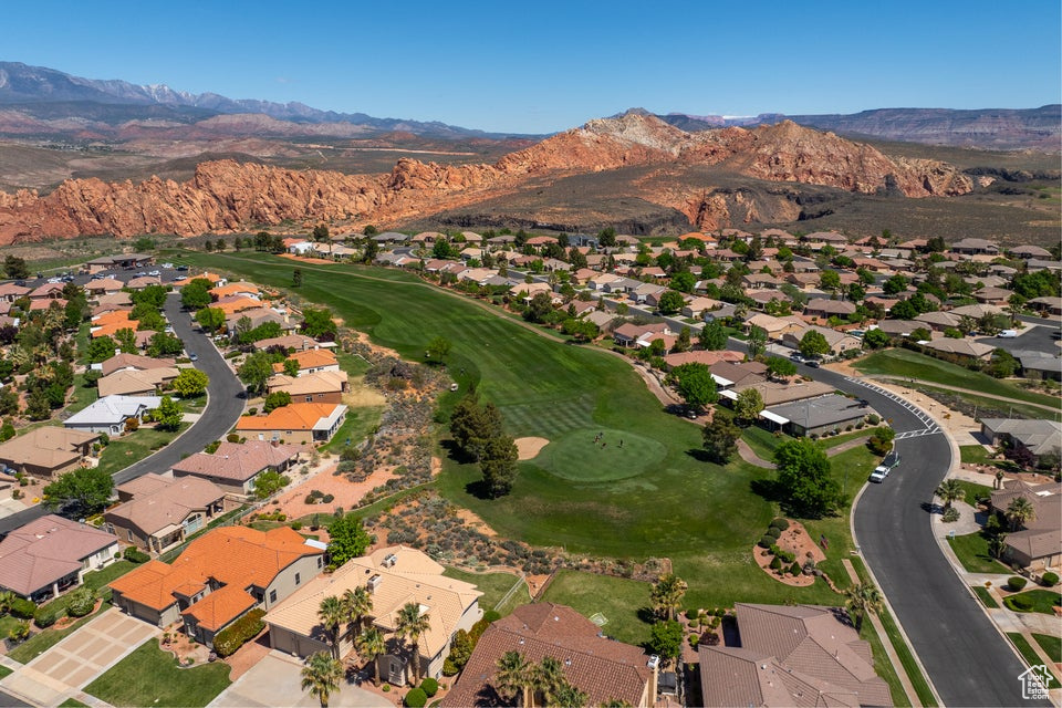 View of property location with a mountain backdrop, nearby suburban area, and a local golf course