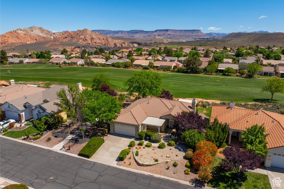 Aerial perspective of suburban area with a mountain backdrop