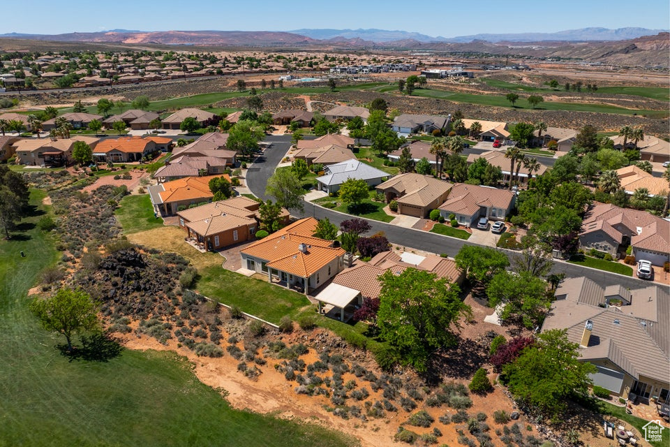 Aerial perspective of suburban area featuring a mountainous background