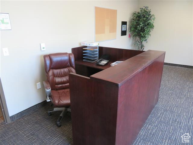 Office with carpet and baseboards