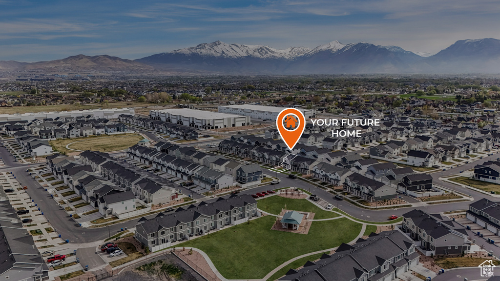 Drone / aerial view with a residential view and a mountain view