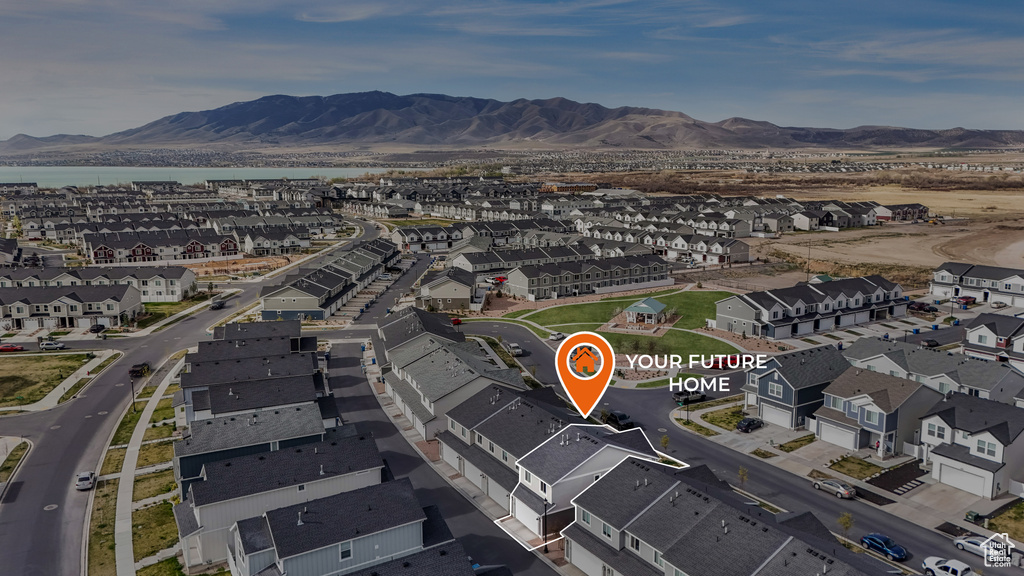 Drone / aerial view with a residential view and a mountain view