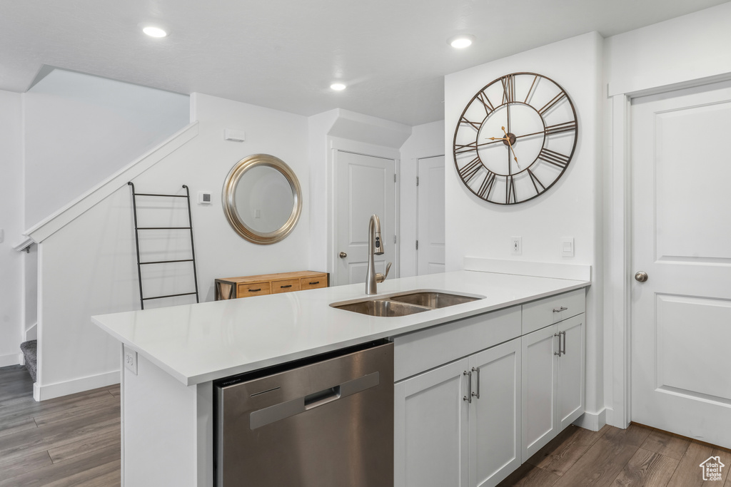 Bar with dishwasher, dark wood-style flooring, a sink, and recessed lighting