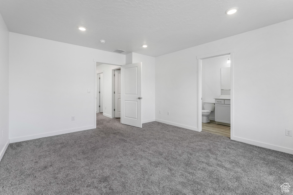 Unfurnished bedroom featuring recessed lighting, baseboards, visible vents, and carpet