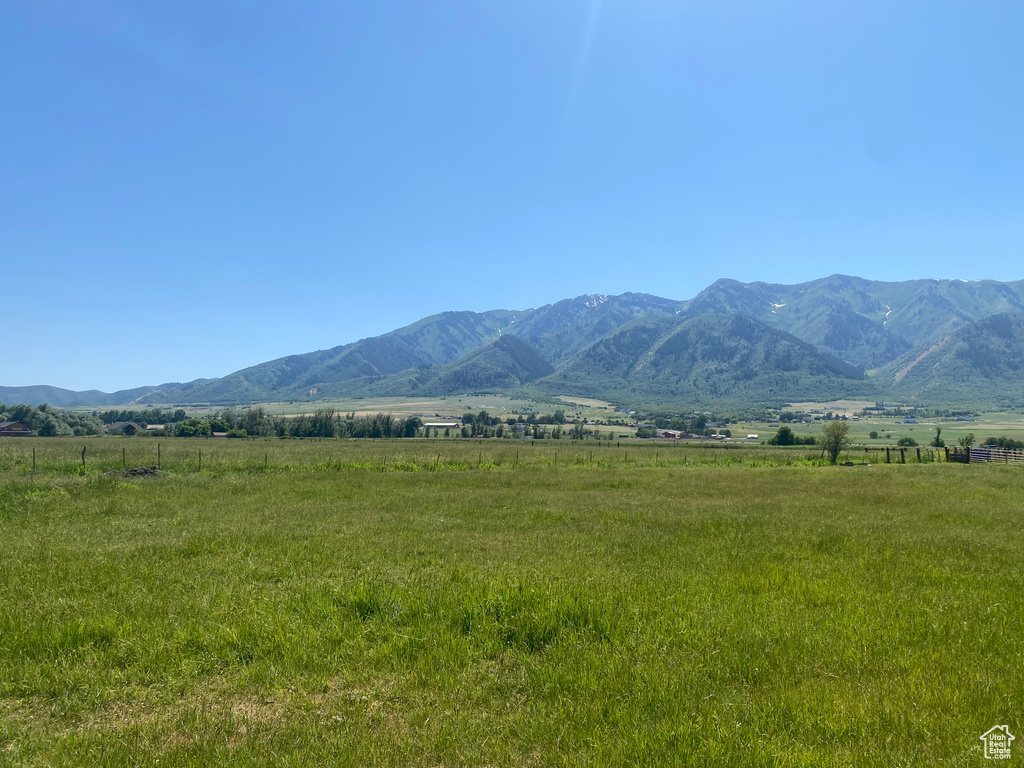 View of mountain background featuring rural landscape