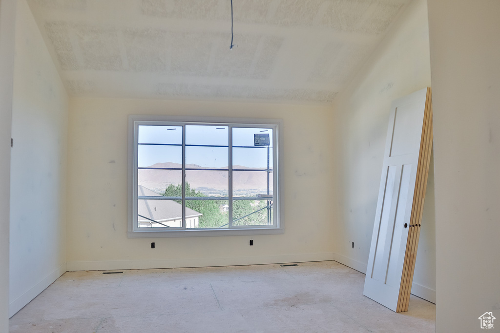 Unfurnished room with baseboards