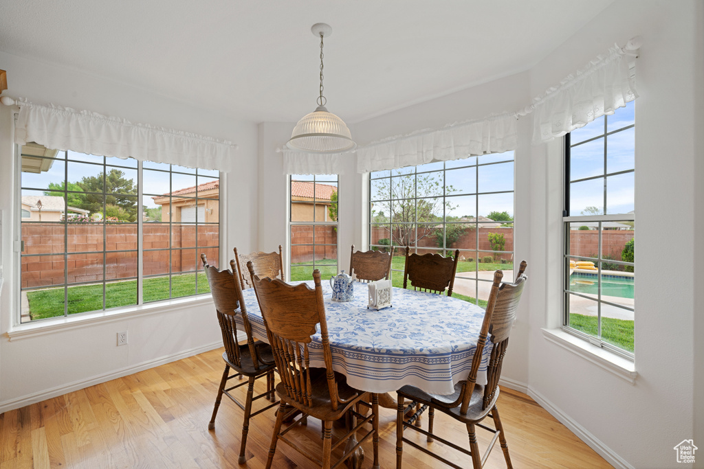 Dining area featuring baseboards and light wood-style flooring