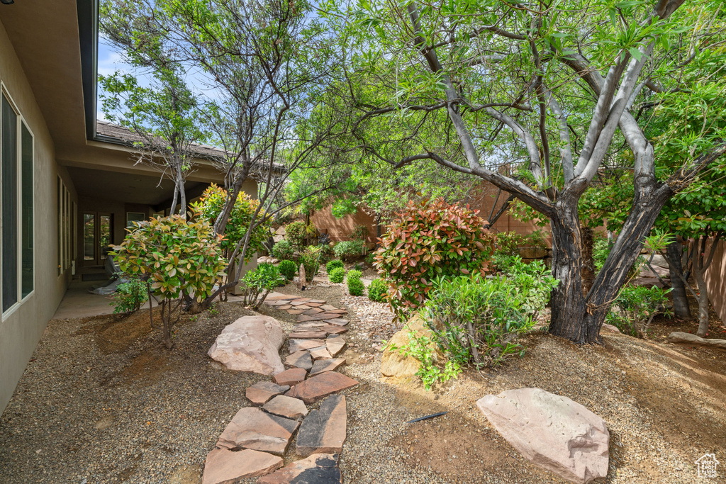View of yard featuring fence