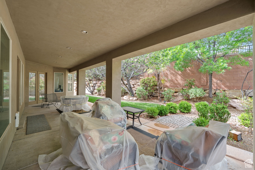 View of patio featuring grilling area and a fenced backyard