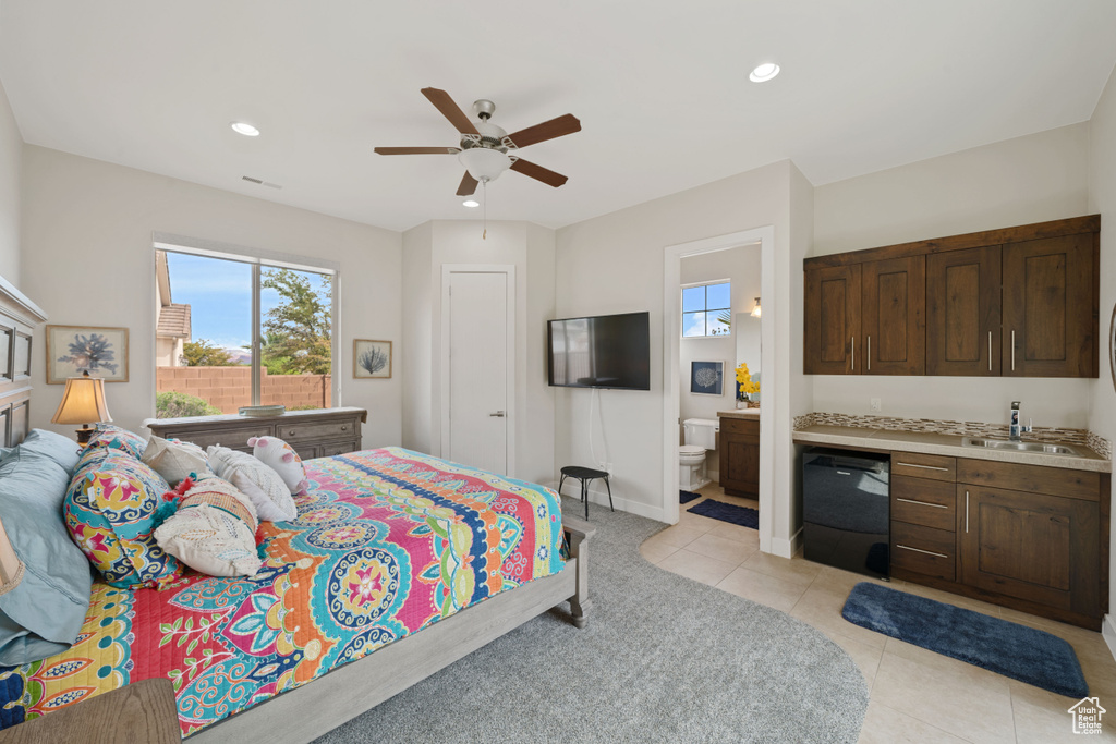 Bedroom featuring a sink, baseboards, recessed lighting, connected bathroom, and light tile patterned floors