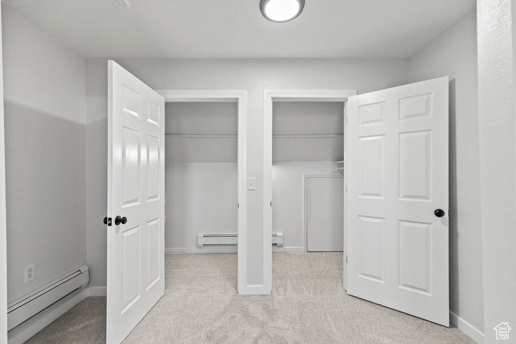 Closet featuring a baseboard radiator