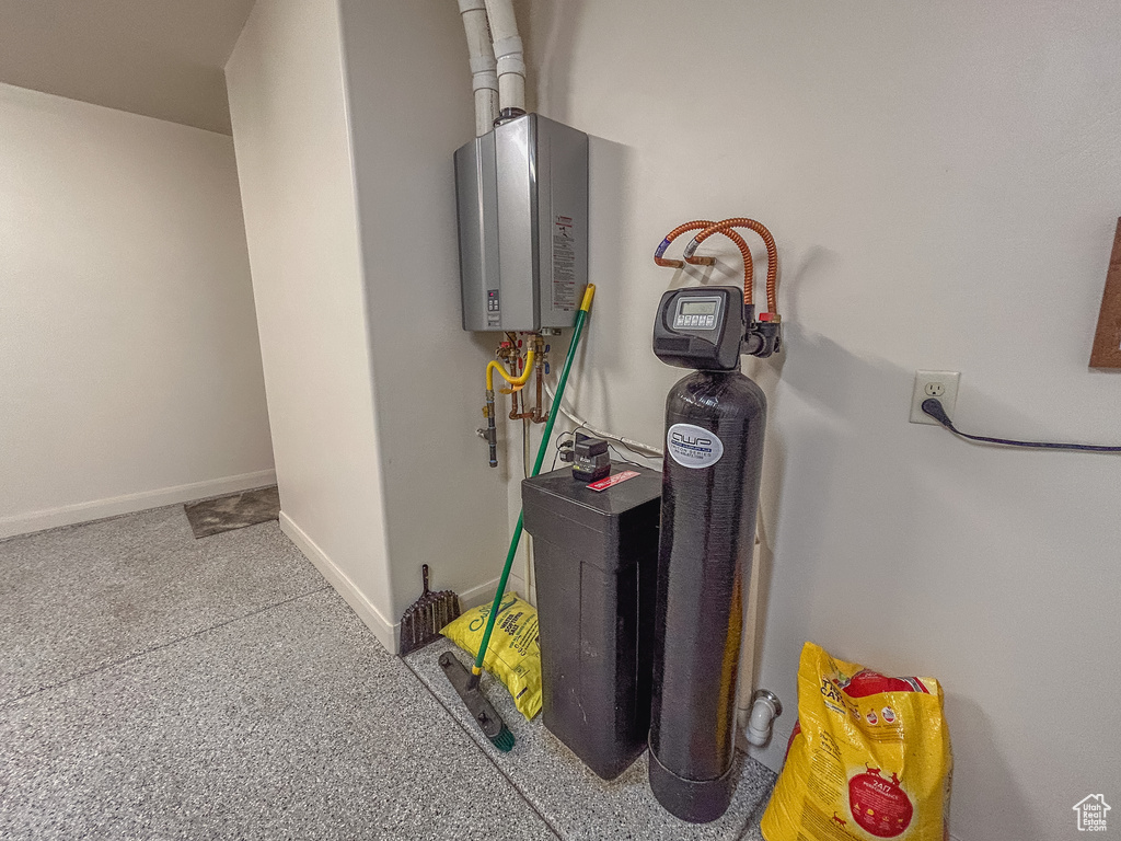 Utility room featuring water heater