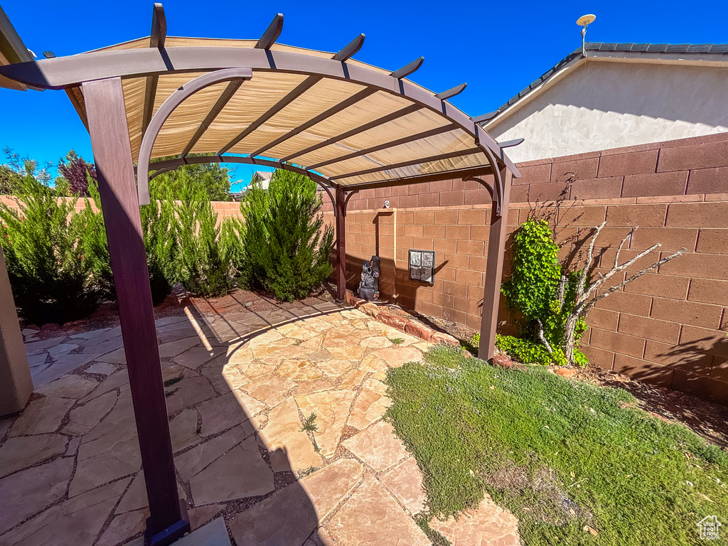 View of patio / terrace with a pergola and a fenced backyard