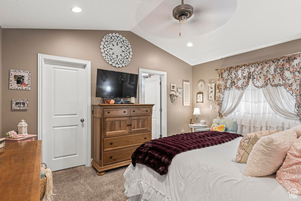 Bedroom featuring recessed lighting, lofted ceiling, a ceiling fan, and light carpet