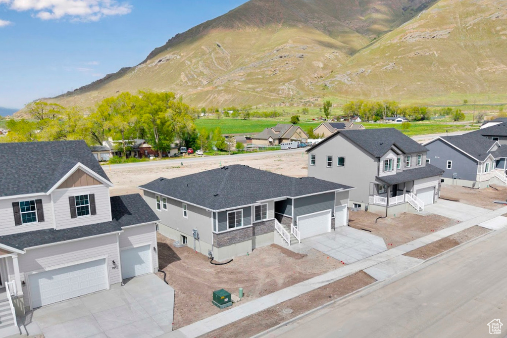 Aerial view of residential area featuring a mountain backdrop