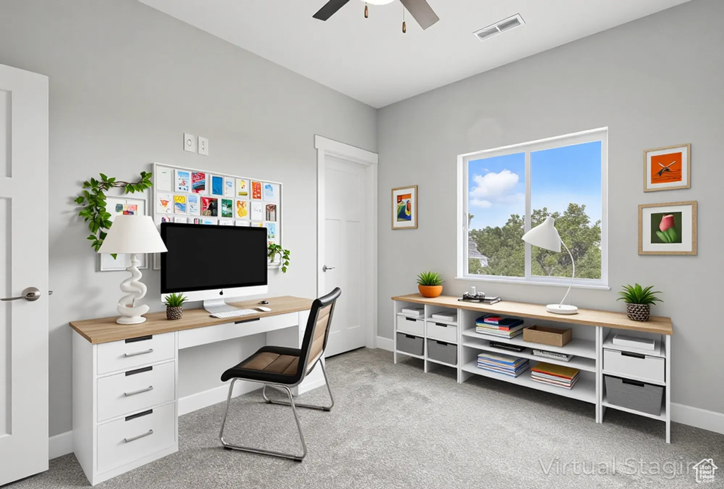 Carpeted home office with ceiling fan and baseboards