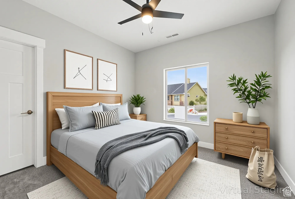 Bedroom featuring carpet, baseboards, and a ceiling fan