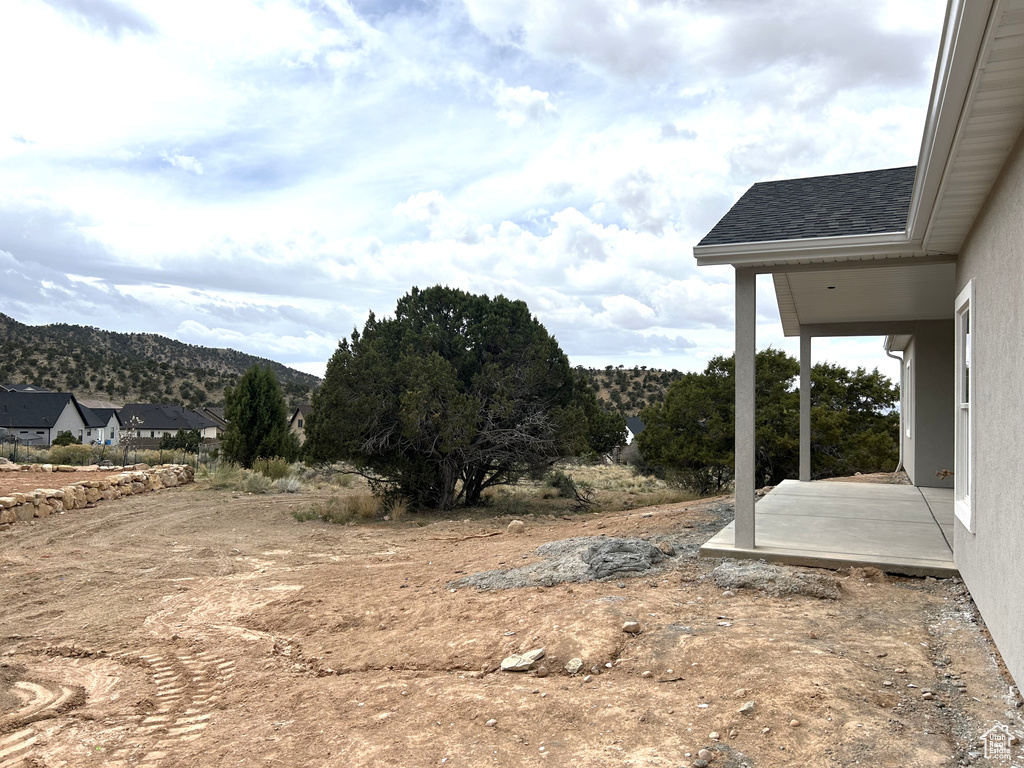 View of yard featuring a patio area and a mountain view